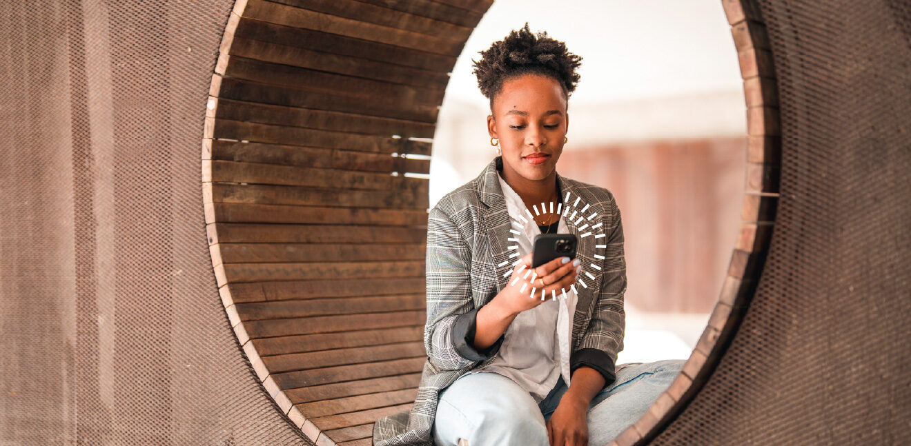 a girl in a blazer looking at her cellphone